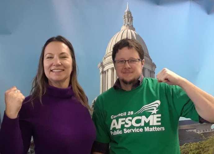 Jordan Harrington, a financial aid advisor and union steward at Green River College, with Lonnie Hunter, another steward at Green River College. 
